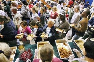 Thanksgiving in Delray beach of people serving food at a food bank.