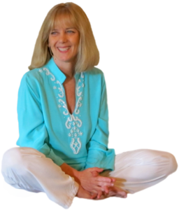 Sitting blonde hair smiling lady wearing blue and white pants