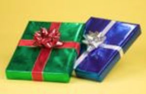a red and blue gift wrapped in ribbon on a yellow background.